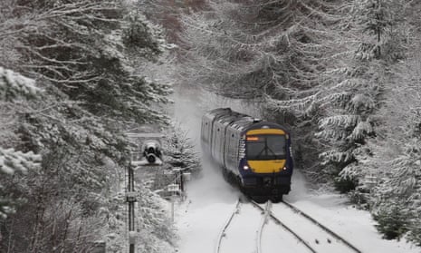 A train battles through the snow at Moy, near Inverness.