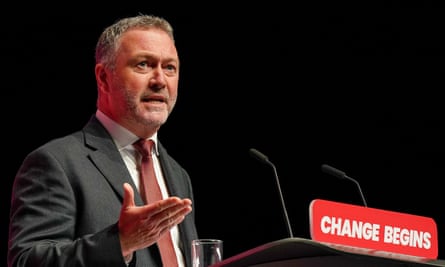 Steve Reed standing at a podium