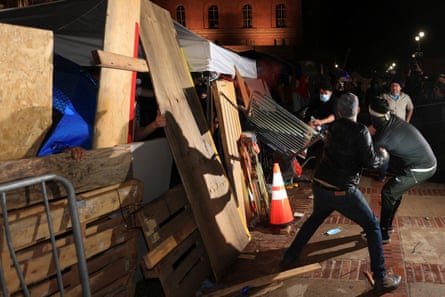 Attackers strike a barricade at a pro-Palestinian encampment on the UCLA campus.