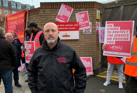 Royal Mail strikeMark Dolan, London divisional rep for the CWU, with striking postal workers outside the Royal Mail Islington delivery office in north London.