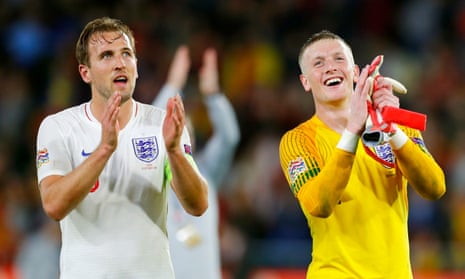 Harry Kane and Jordan Pickford applaud the fans after England’s victory against Spain Seville