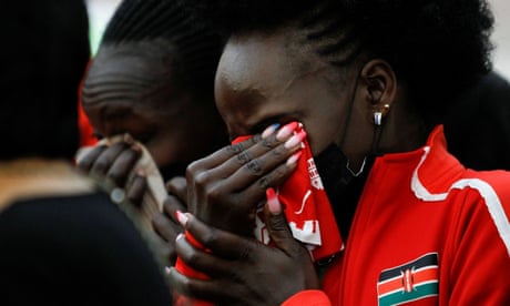 Kenyan athletes mourn during the funeral service of long-distance runner Agnes Tirop in Kapnyamisa village, Nandi county, Kenya.