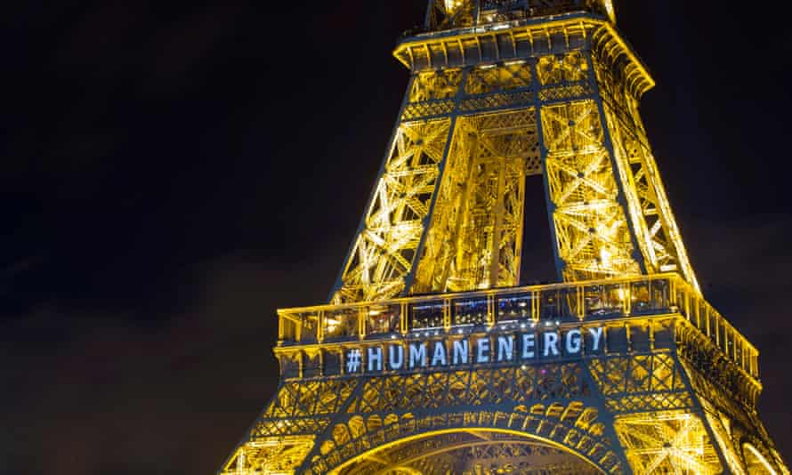 Art installation on the Eiffel Tower in Paris by artist Yann Toma drawing attention to man-made energy, December 2015.