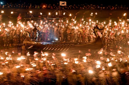 At the Up Helly Aa festival up to 1,000 Viking paraders set a galley ablaze by throwing torches into it.