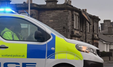 Police block a road in Kinghorn for safety reasons after part of the roof of a residential building was torn off by high winds.