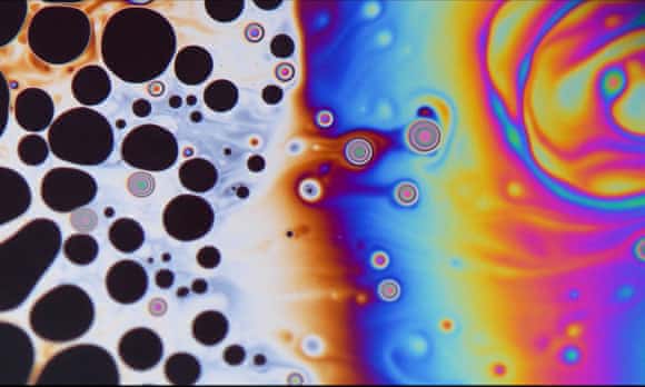 The fluid instability patterns on top of a soap bubble.