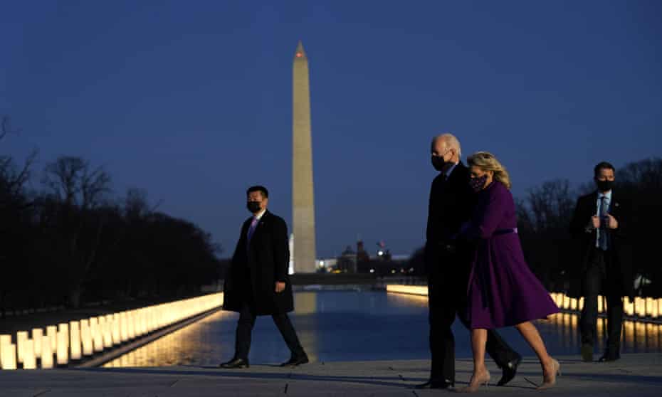 The Bidens at a Covid memorial at the Lincoln Memorial reflecting pool on 19 January.