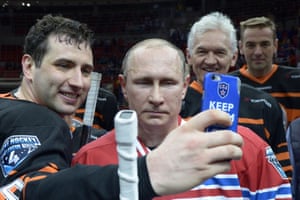 Vladimir Putin pictured with Gennady Timchenko, second right, who has been targeted by UK sanctions.