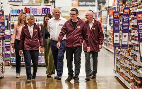 Andy Burnham accompanied by mayor of London Sadiq Khan and work and pensions Secretary Pat McFadden during his visit to Sainsbury's .