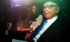 News Corp chief Rupert Murdoch, (R) his wife Wendi Deng (C) and son Lachlan (L) leave their London home on April 26, 2012, as Rupert Murdoch prepares to give evidence for a second day at the Leveson Inquiry. Rupert Murdoch denied Wednesday that he had exerted a decades-long stranglehold over British politics as he finally testified at an inquiry sparked by the misdeeds of his media empire. AFP PHOTO / BEN STANSALLBEN STANSALL/AFP/GettyImages