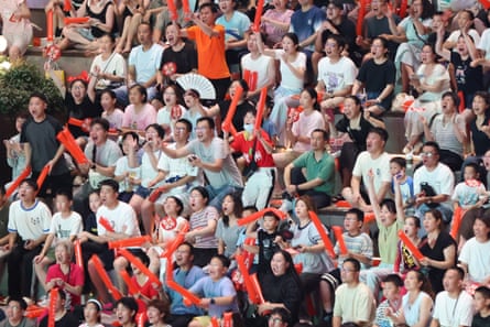 People gather at the Changzhou Culture Plaza to watch a match in August last year.