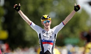 Matej Mohoric of Slovenia celebrates winning stage 19.