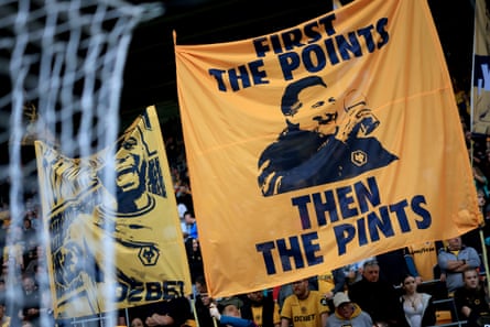 Wolves fans display a banner which reads ‘First the points, then the pints’ and features a picture of Vítor Pereira