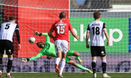 Wrexham goalkeeper Ben Foster saves a late penalty from Cedwyn Scott of Notts County