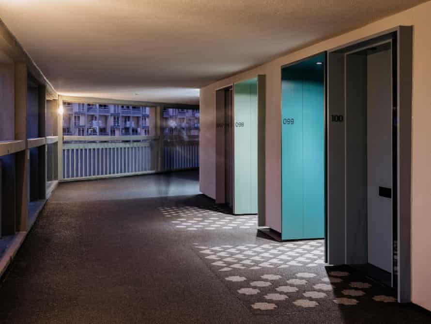 Geometric patterns have been cast in front of each front door, inspired by the 1970s lino doormats that residents laid outside their flats.