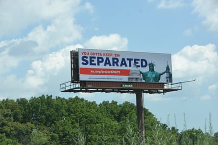 white billboard with red and blue words: ‘You gotta keep ‘em separated’