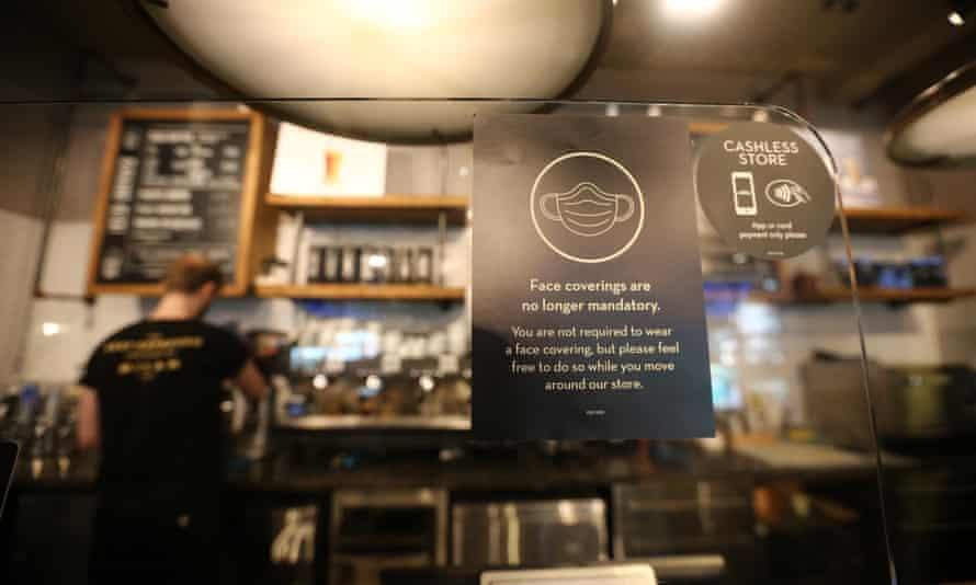 A sign telling customers that face masks are no longer mandatory in a coffee shop in London.