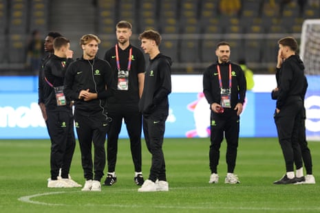 The Socceroos inspect the pitch earlier this evening.