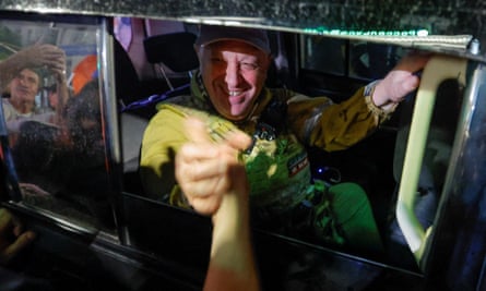 Prigozhin shakes hands with supporters as he leaves Rostov
