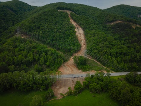 wide shot of landslide down green hill