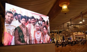 Gali Janardhan Reddy, centre of the screen, with his daughter and son-in-law during the wedding.