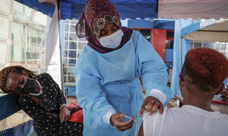 A nurse gives a Covid vaccine at a health centre in Nairobi