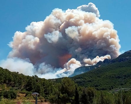 A huge pall of smoke rises high into the sky