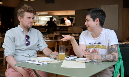 Two people sitting talking at a restaurant table