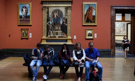 Visitors sit in one of the few rooms open at the National Gallery.