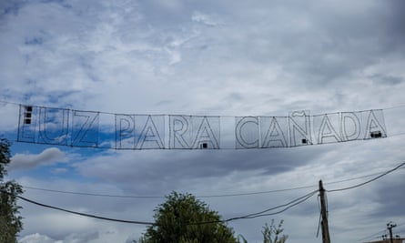 Banner demanding “Light for Cañada” on the main street of Cañada Real.