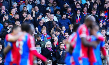 Crystal Palace fans celebrate after Jordan Ayew’s goal against Burnley.