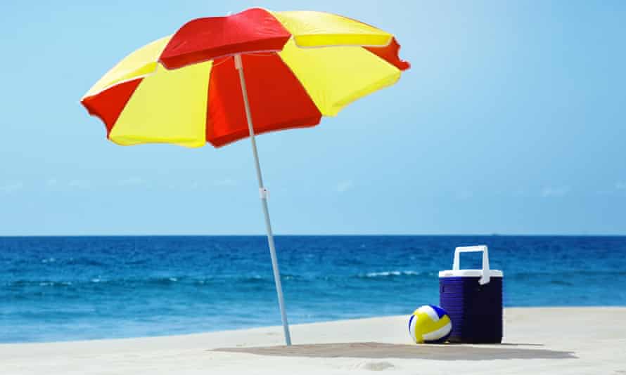Roaming charges return: how will the dreaded charge affect UK travellers? | Mobile phones 2 Empty beach with umbrella and accessories
