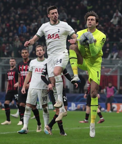 Ciprian Tatarusanu of AC Milan is challenged by Clement Lenglet of Tottenham Hotspur.
