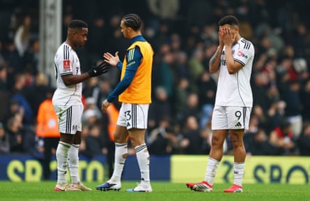 Fulham’s Rodrigo Muniz (right) puts his face in his hands after the defeat.