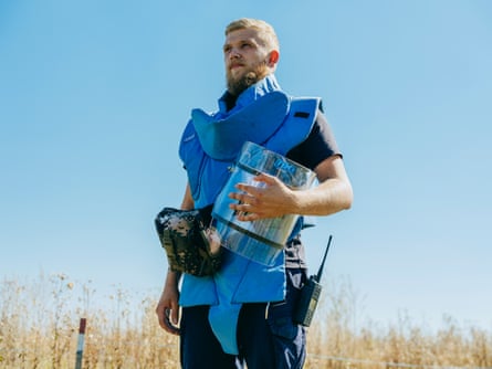 Mykyta Shulzhenko wearing protective gear and holding a visor.