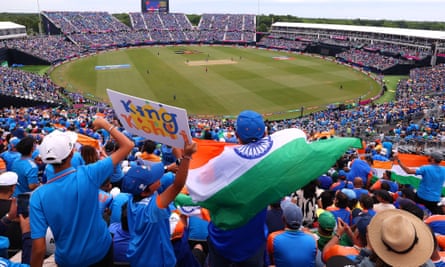 An India fan waves a Kohli flag during the game against Pakistan