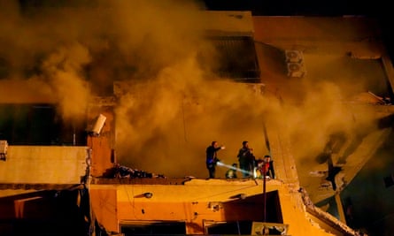 Smoke rises from a destroyed apartment building in Dahiyeh, Lebanon, where Arouri died.