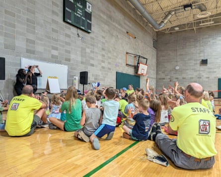 children sit on the floor