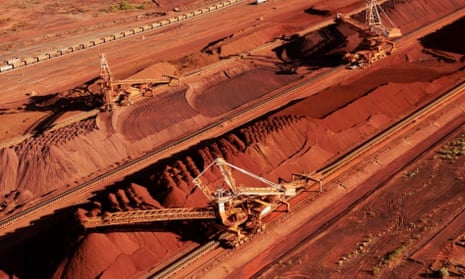 Iron ore being stockpiled for export at Port Hedland in Western Australia. BHP Billiton is on the cusp of destroying 86 Indigenous sites in the central Pilbara to expand its South Flank iron ore mining operation. 