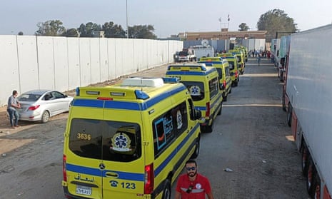 An Egyptian ambulance convoy waits at the Rafah crossing.