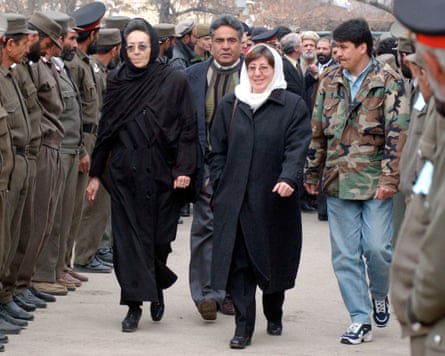 Sima Samar walks alongside Afghanistan health minister, Suhaila Siddiqi, as part of a new interim government in 2001