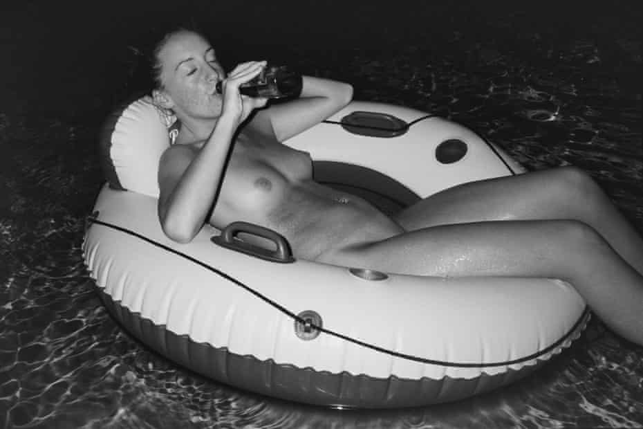 Pregnant girl drinking beer.