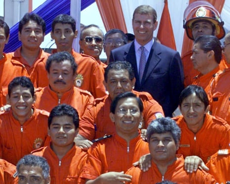 Prince Andrew poses with firefighters in Lima, Peru on 8 March 2002.