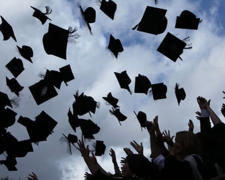 In the bottom right corner, we see silhouetted students with their hands in the air, having tossed the graduation caps towards the sky. A flock of caps dominates the rest of the image.
