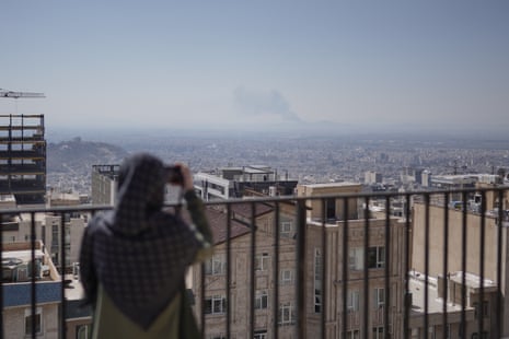 Asal, 35, on her rooftop.