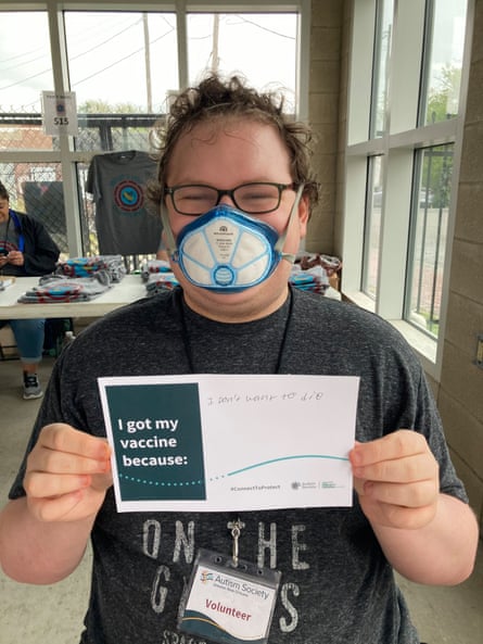 a young man holding a sign