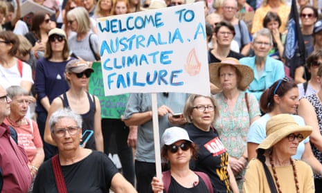 Climate crisis protester holding sign