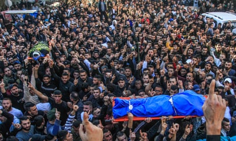 Mourners on 16 March carry the bodies of two Palestinians shot dead by Israeli forces in Jenin. 