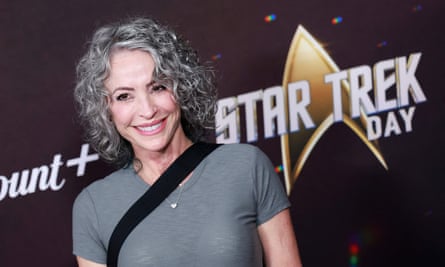 Nana Visitor in front of a sign for Paramount+ Star Trek Day
