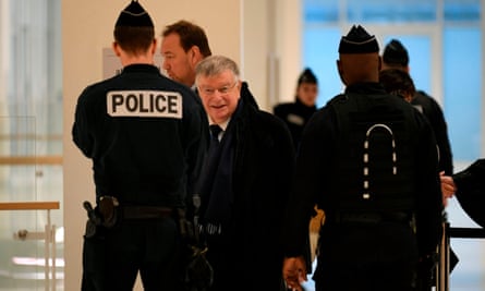 Former France Telecom CEO Didier Lombard (centre) arrives at the Paris courthouse
